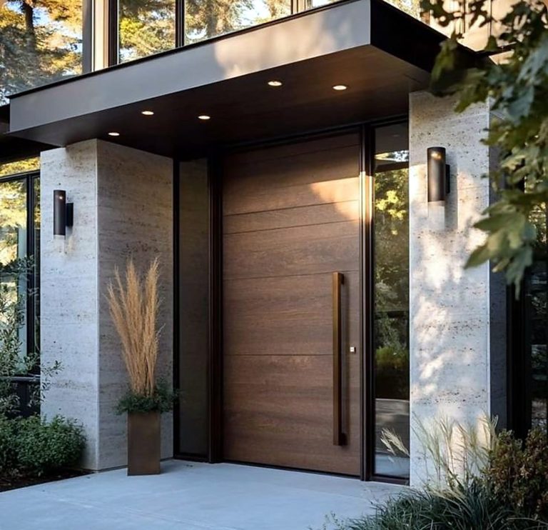 Walnut pivot entrance between travertine piers – Grand Design International